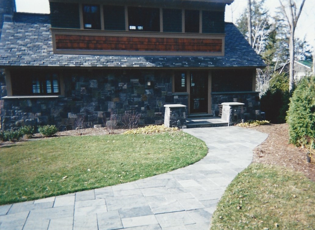 stone walk and stone veneer home